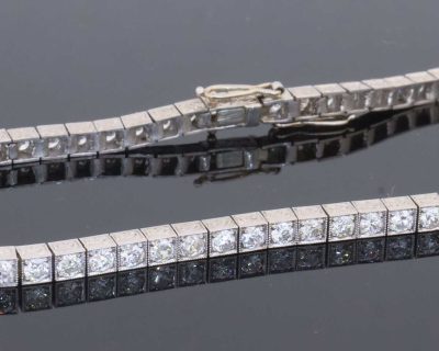 A superb antique Edwardian diamond line bracelet, dating to circa 1910 and characteristic of the elegant, refined jewellery of the period. Designed to allow the diamonds to take centre stage, the bracelet is set throughout with approximately four carats of Old European-cut diamonds, creating a continuous line of lively brilliance. The Edwardian period was renowned for its use of platinum and finely articulated diamond jewellery, with designs becoming increasingly light, elegant and focused on the natural beauty of the stones. This bracelet captures that aesthetic beautifully.
