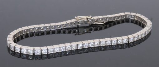 A superb antique Edwardian diamond line bracelet, dating to circa 1910 and characteristic of the elegant, refined jewellery of the period. Designed to allow the diamonds to take centre stage, the bracelet is set throughout with approximately four carats of Old European-cut diamonds, creating a continuous line of lively brilliance. The Edwardian period was renowned for its use of platinum and finely articulated diamond jewellery, with designs becoming increasingly light, elegant and focused on the natural beauty of the stones. This bracelet captures that aesthetic beautifully.