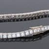 A superb antique Edwardian diamond line bracelet, dating to circa 1910 and characteristic of the elegant, refined jewellery of the period. Designed to allow the diamonds to take centre stage, the bracelet is set throughout with approximately four carats of Old European-cut diamonds, creating a continuous line of lively brilliance. The Edwardian period was renowned for its use of platinum and finely articulated diamond jewellery, with designs becoming increasingly light, elegant and focused on the natural beauty of the stones. This bracelet captures that aesthetic beautifully.