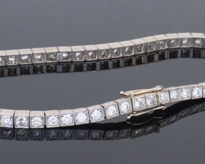 A superb antique Edwardian diamond line bracelet, dating to circa 1910 and characteristic of the elegant, refined jewellery of the period. Designed to allow the diamonds to take centre stage, the bracelet is set throughout with approximately four carats of Old European-cut diamonds, creating a continuous line of lively brilliance. The Edwardian period was renowned for its use of platinum and finely articulated diamond jewellery, with designs becoming increasingly light, elegant and focused on the natural beauty of the stones. This bracelet captures that aesthetic beautifully.