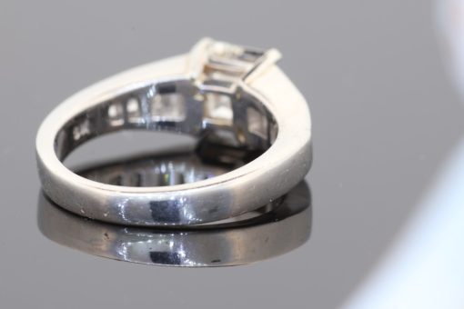 A superb diamond ring distinguished by the striking geometry of a rare carré-cut diamond. Celebrated for its clean lines and architectural elegance, the carré cut brings a distinctive character to this exceptional design, beautifully complemented by the precision and sparkle of its accompanying diamonds.
