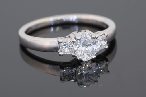 A timeless expression of elegance, this three-stone diamond ring brings together classic proportions and refined platinum craftsmanship. Its balanced design celebrates the enduring appeal of diamonds, making it a sophisticated choice for an engagement ring or a treasured addition to a fine jewellery collection.