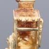 A wonderfully rare 9kt gold novelty charm in the form of a traditional cooker, complete with a charming surprise inside. The piece is a delightful example of the whimsical and imaginative approach taken to novelty jewellery, transforming an everyday household object into a miniature gold charm.