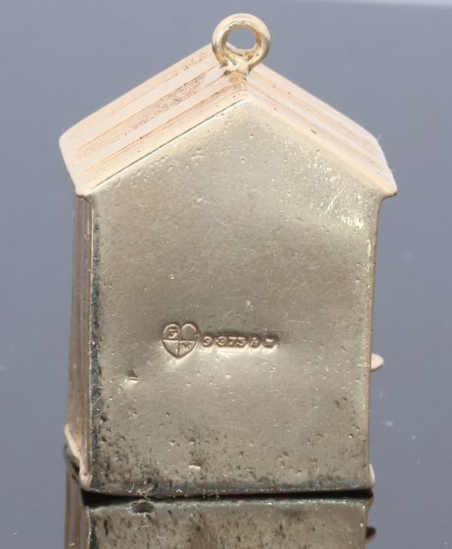 An extremely rare and wonderfully whimsical large gold charm depicting a Punch & Judy show, capturing the theatrical character and humour of one of Britain’s most enduring forms of popular entertainment. Punch & Judy performances have long been associated with seaside resorts, fairs and street entertainment, making this an especially charming subject for a piece of jewellery. The remarkable mechanical element makes the charm particularly unusual and collectible.