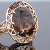 A distinctive garnet ring that combines the rich red tones of this classic gemstone with the clean lines of modernist design. Its openwork construction lends the piece a sense of lightness and sculptural character, creating an appealing contrast with the warmth of the gold and the depth of colour of the garnet.
