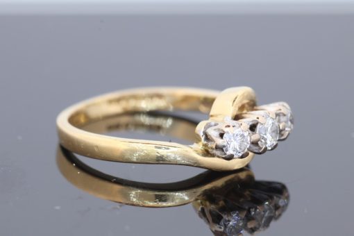 Elegant and graceful, this diamond three-stone twist ring combines the timeless appeal of diamonds with the fluid lines of a beautifully sculptural design. Its flowing silhouette brings a contemporary touch to a classic jewellery style, creating a versatile piece with enduring charm.