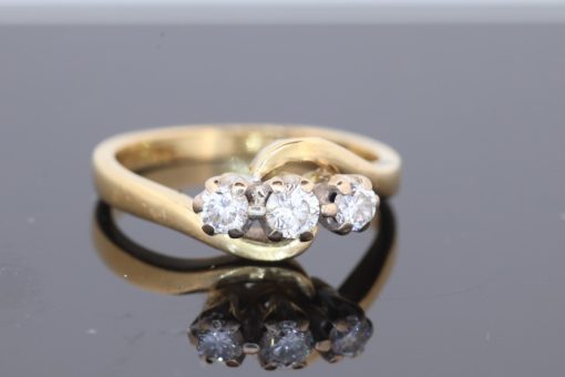 Elegant and graceful, this diamond three-stone twist ring combines the timeless appeal of diamonds with the fluid lines of a beautifully sculptural design. Its flowing silhouette brings a contemporary touch to a classic jewellery style, creating a versatile piece with enduring charm.