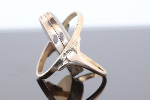 An exceptional Victorian locket ring dating to circa 1870, a fascinating example of the ingenuity and sentimentality that characterised nineteenth-century jewellery. During the Victorian era, personal jewellery often carried intimate meaning, with hidden compartments and keepsake designs allowing treasured photographs and mementoes to be kept close. This remarkable ring combines that romantic tradition with an unusual and ingenious mechanism.