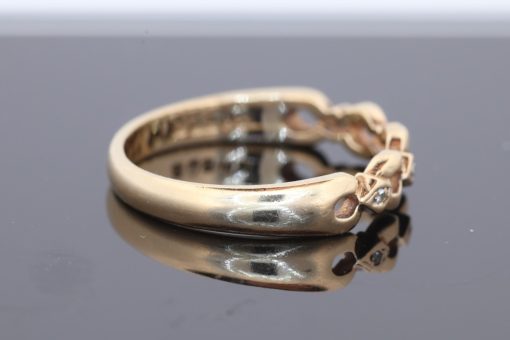 An elegant gold dress ring with timeless appeal, offering a versatile addition to a fine jewellery collection. Its classic simplicity celebrates the warmth and enduring beauty of gold jewellery.