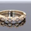 An elegant gold dress ring with timeless appeal, offering a versatile addition to a fine jewellery collection. Its classic simplicity celebrates the warmth and enduring beauty of gold jewellery.