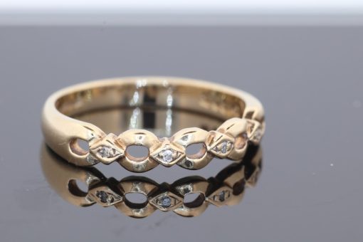 An elegant gold dress ring with timeless appeal, offering a versatile addition to a fine jewellery collection. Its classic simplicity celebrates the warmth and enduring beauty of gold jewellery.