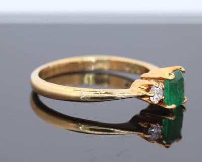 An elegant emerald and diamond ring, combining the rich green hues of emerald with the timeless brilliance of diamonds. This classic gemstone pairing has long been admired for its striking contrast of colour and sparkle, creating a jewel with enduring appeal.