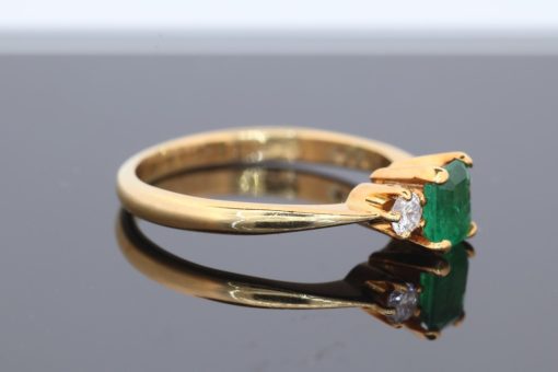 An elegant emerald and diamond ring, combining the rich green hues of emerald with the timeless brilliance of diamonds. This classic gemstone pairing has long been admired for its striking contrast of colour and sparkle, creating a jewel with enduring appeal.