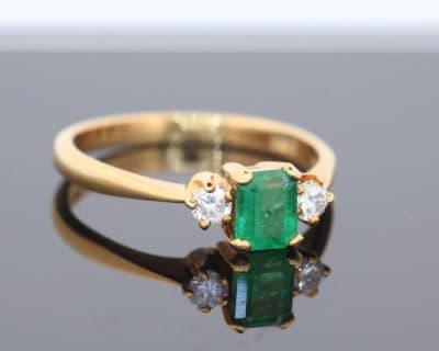 An elegant emerald and diamond ring, combining the rich green hues of emerald with the timeless brilliance of diamonds. This classic gemstone pairing has long been admired for its striking contrast of colour and sparkle, creating a jewel with enduring appeal.
