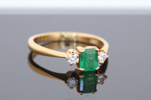 An elegant emerald and diamond ring, combining the rich green hues of emerald with the timeless brilliance of diamonds. This classic gemstone pairing has long been admired for its striking contrast of colour and sparkle, creating a jewel with enduring appeal.