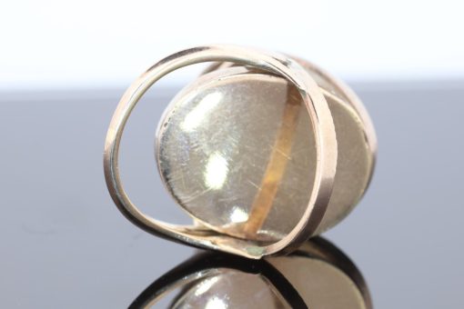 An exceptional Victorian locket ring dating to circa 1870, a fascinating example of the ingenuity and sentimentality that characterised nineteenth-century jewellery. During the Victorian era, personal jewellery often carried intimate meaning, with hidden compartments and keepsake designs allowing treasured photographs and mementoes to be kept close. This remarkable ring combines that romantic tradition with an unusual and ingenious mechanism.