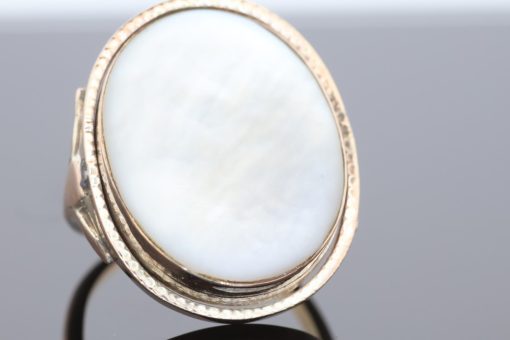 An exceptional Victorian locket ring dating to circa 1870, a fascinating example of the ingenuity and sentimentality that characterised nineteenth-century jewellery. During the Victorian era, personal jewellery often carried intimate meaning, with hidden compartments and keepsake designs allowing treasured photographs and mementoes to be kept close. This remarkable ring combines that romantic tradition with an unusual and ingenious mechanism.